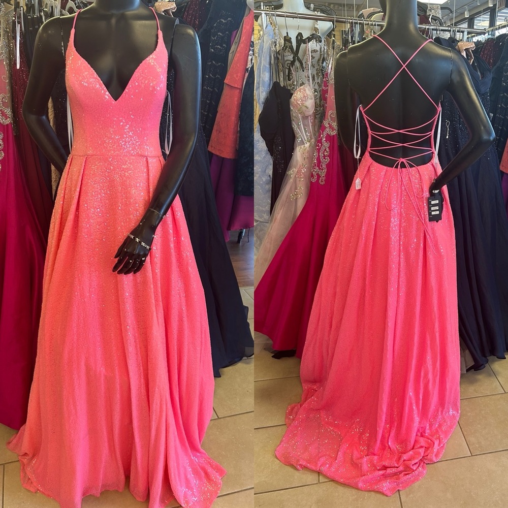 Hot pink a-line ballgown style with tie up adjustable back size 8 with pockets